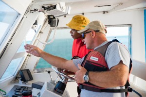 Ron instructing NYHS student how to drive & navigate the Cobia