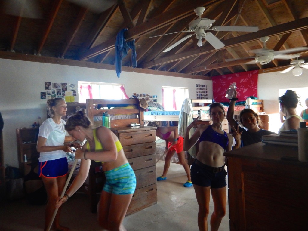 Students Jessa, Maddie, Noelle, Lucy and Maya clean their dorm.