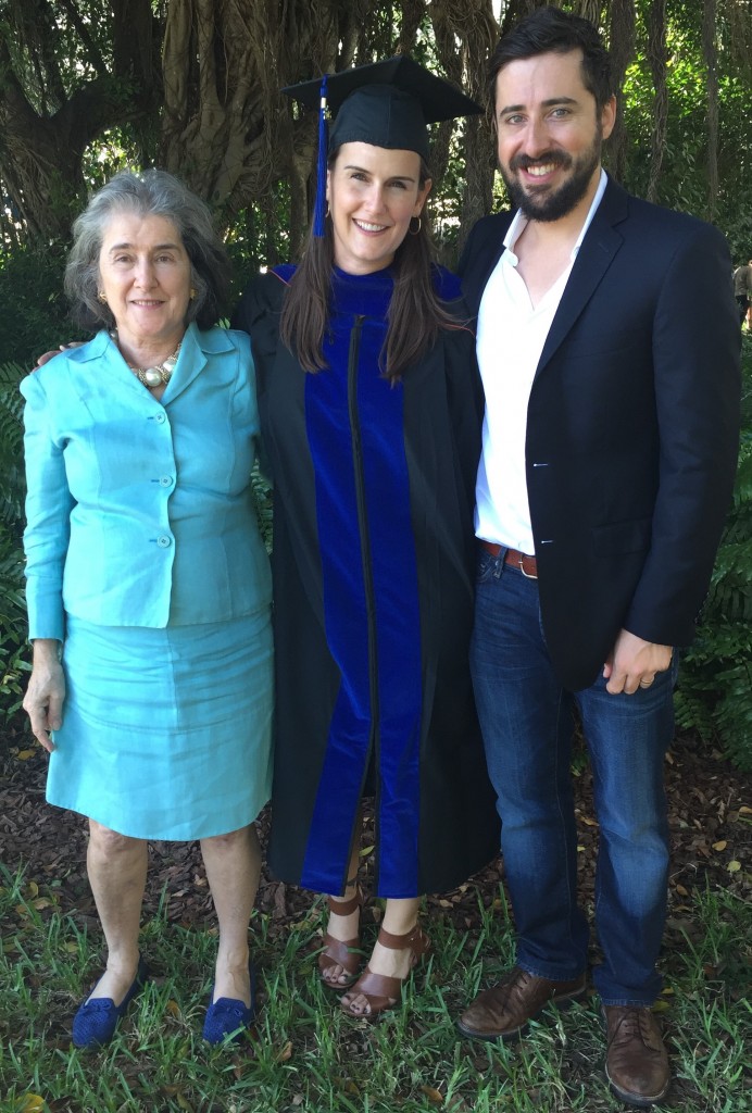 Francesca (center) with her mom (right) and husband (left) at her Ph.D. graduation ceremony